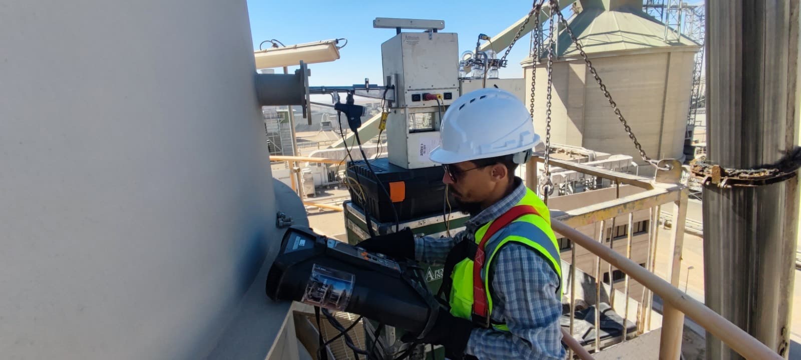 Emissions monitoring at industrial plant with silos